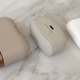 The charging case for Sony’s WF-1000XM3 earbuds was an absolute beast (left) and while the charging case for the Sony WF-1000XM4 earbuds is about half the size (center), it’s still not quite as small and pocketable as the AirPods Pro charging case (right).